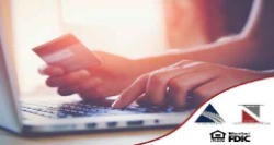 person entering credit card information on their laptop