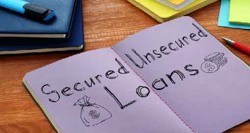 notebook with handwriting saying "secured unsecured loans"